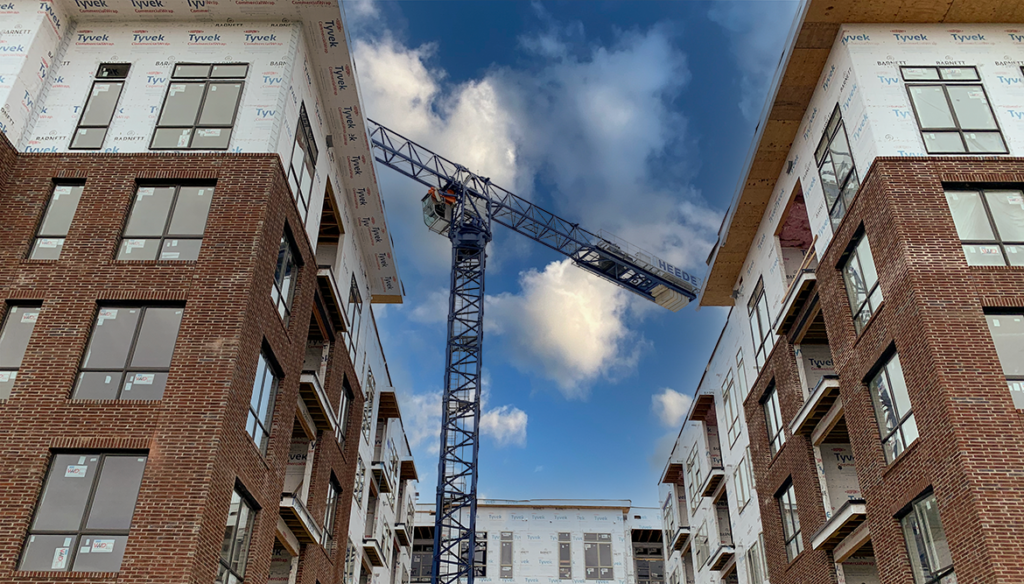 Multi-story building under-construction with crane (DiMarco Constructors)